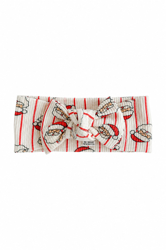 Caden Lane bamboo baby bow headband in the festive Santa stripe print, designed to coordinate with matching Christmas pajamas and holiday outfits for babies and toddlers.