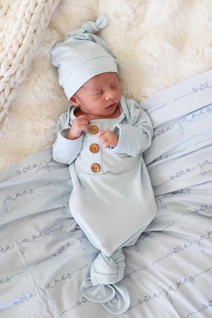 baby blue long sleeve newborn gown with matching hat a personalized swaddle blanket 