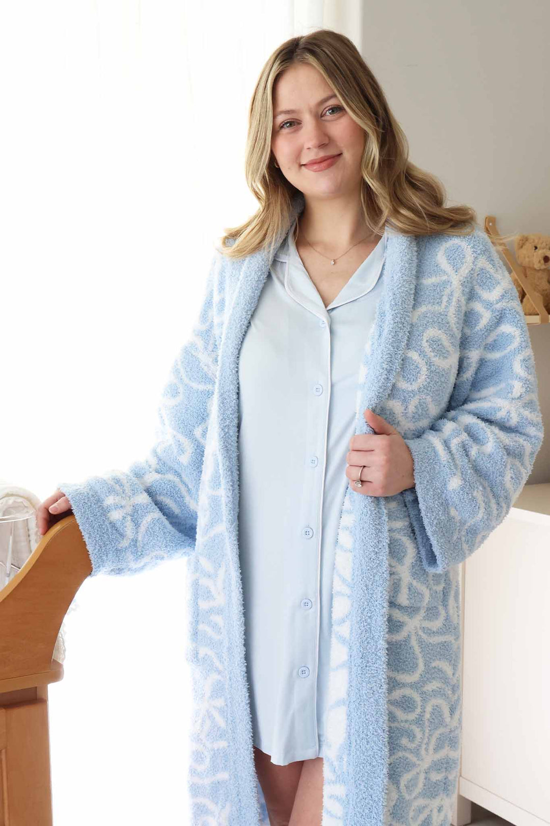 baby blue button up labor & delivery gown with a long sleeve blue plush robe with white bows 