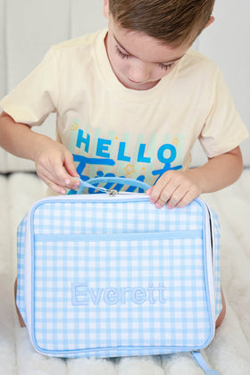 boy unzipping blue gingham embroidered lunchbox