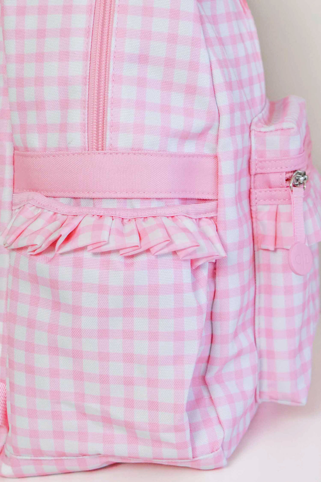 water bottle pocket on pink gingham backpack 