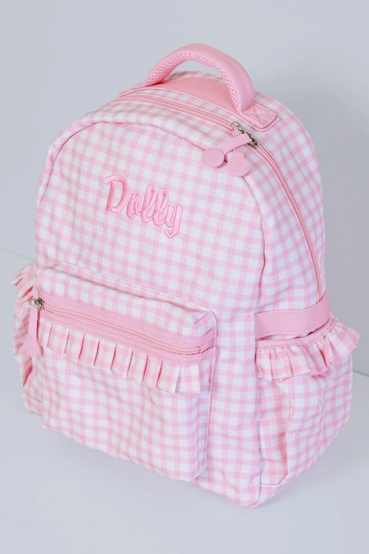 flat lay pink gingham embroidered backpack for girls 