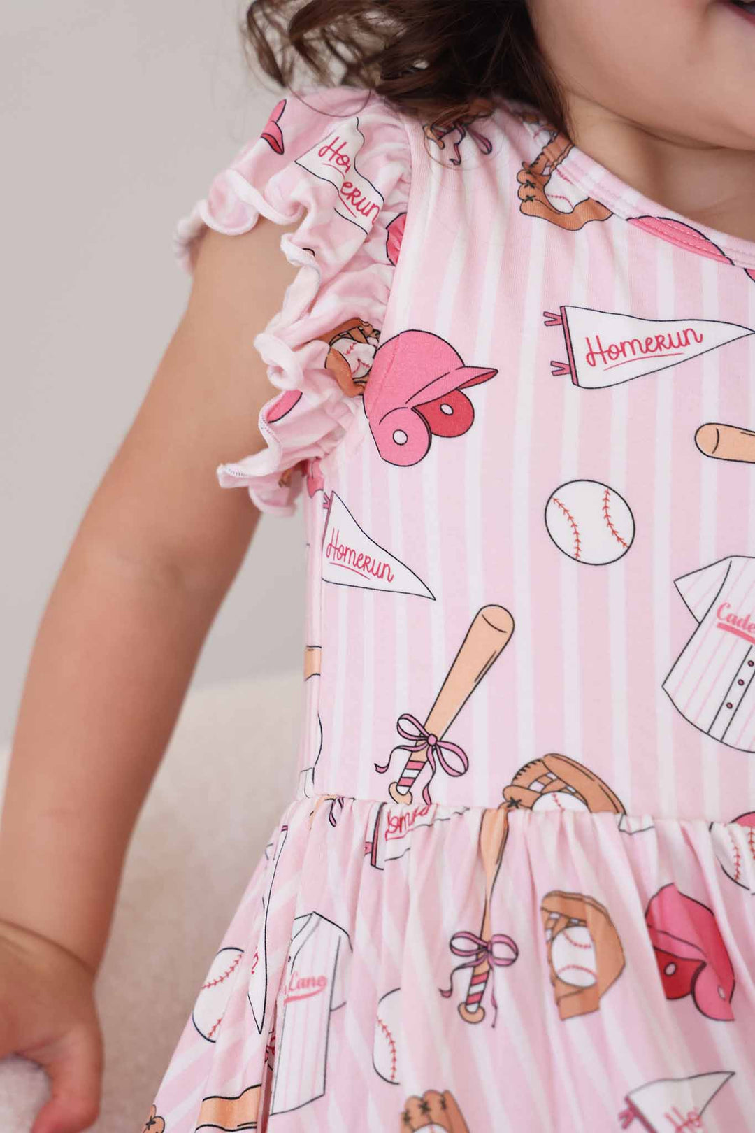 closeup of ballpark babes ruffle twirl dress with stripes