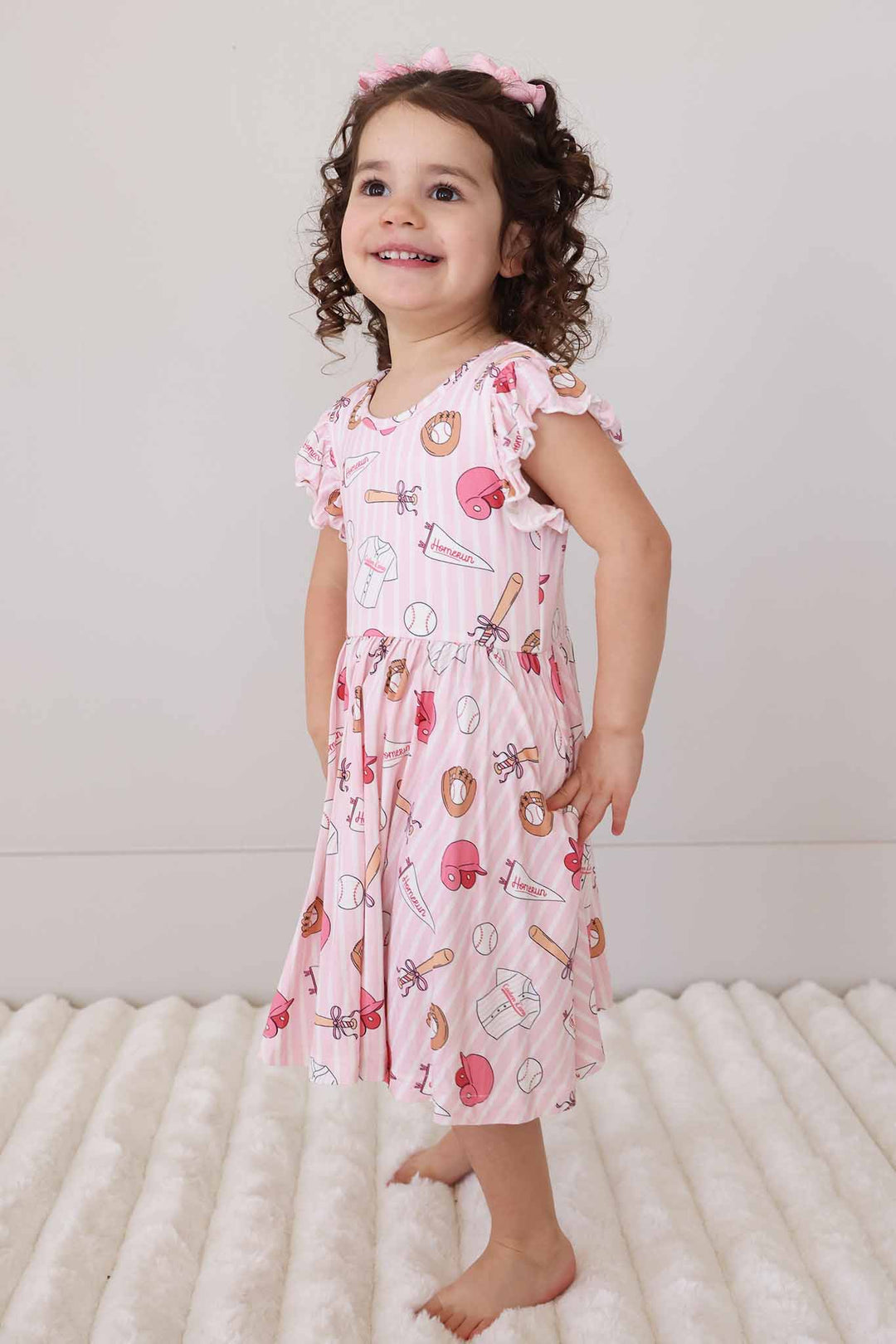 smiling girl in mid length ballpark babes dress 