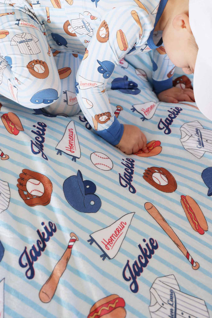 boy pointing to hotdog on ballpark bros personalized blanket with sherpa