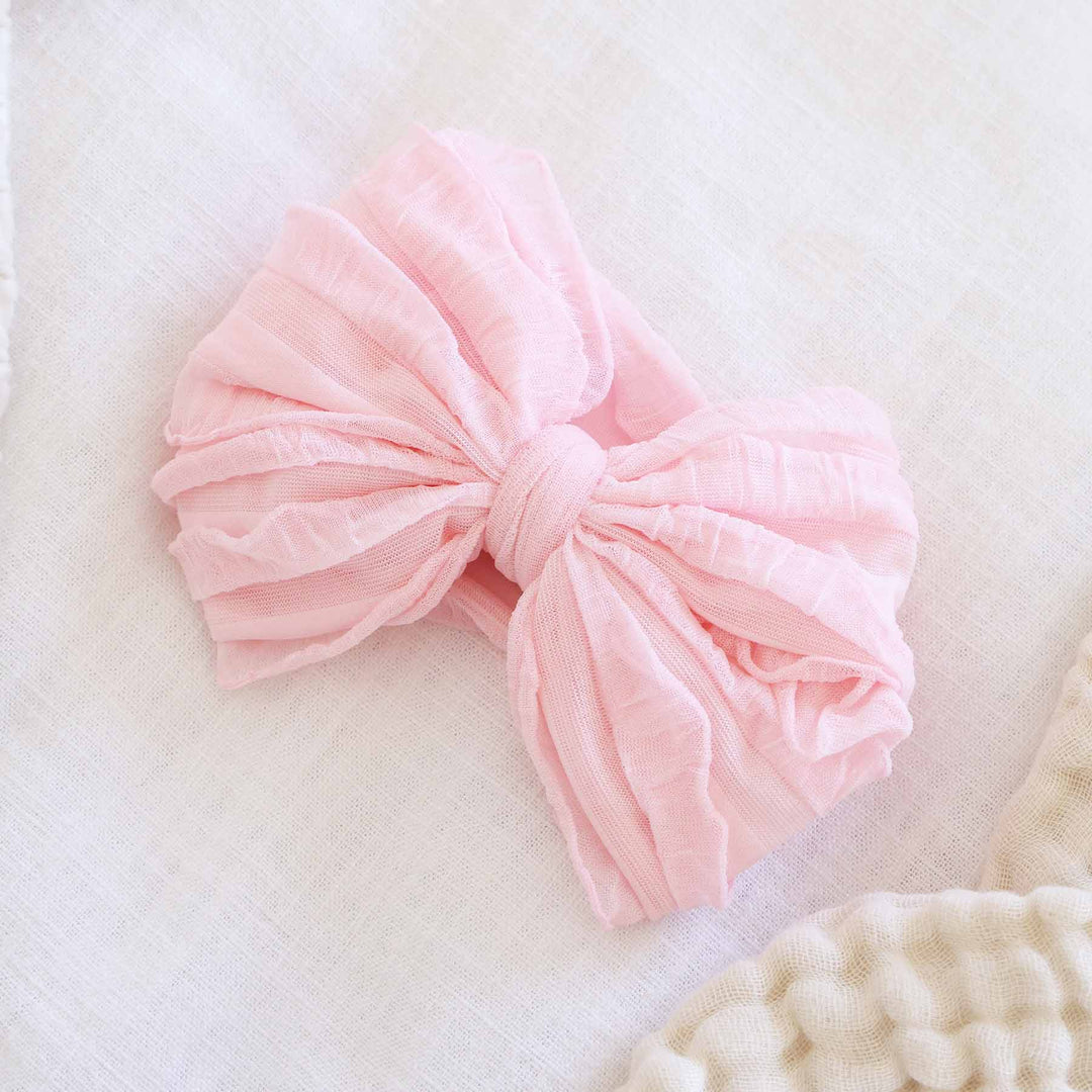 pink large ruffle knit bow for babies 
