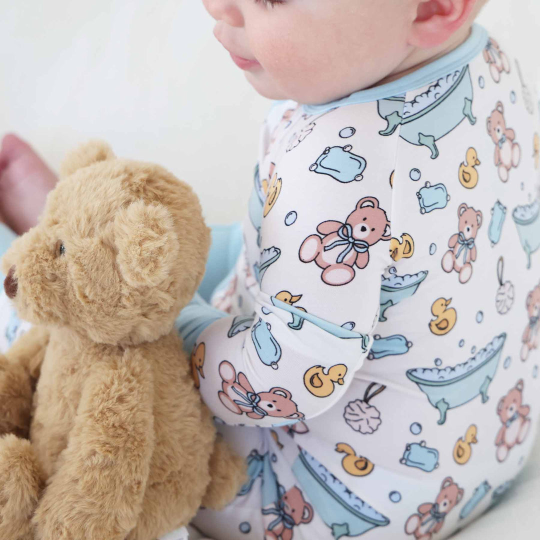 teddy bear, soap, rubber duck, loofa blue bath time besties convertible zip romper pajama for babies and toddlers
