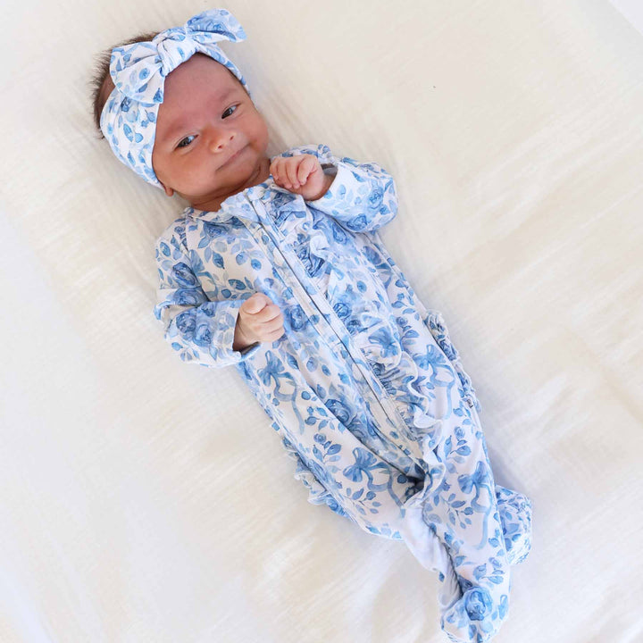 blue floral and bow ruffle zipper footie for girls 