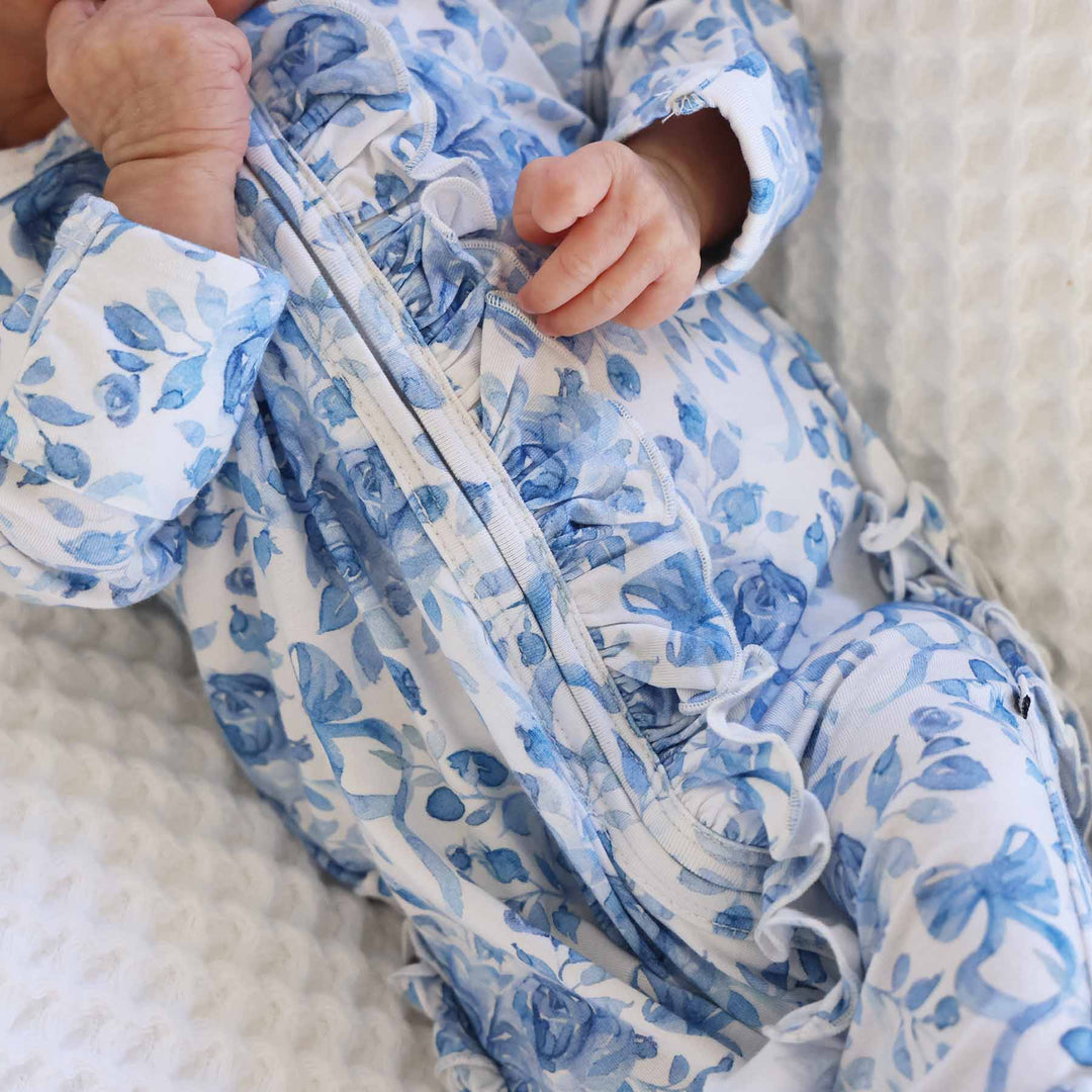bamboo viscose blue and white floral and bow zipper footie for girls with ruffles