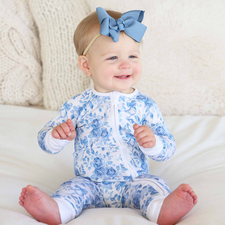blue floral convertible zip romper pajama for girls with white trim 