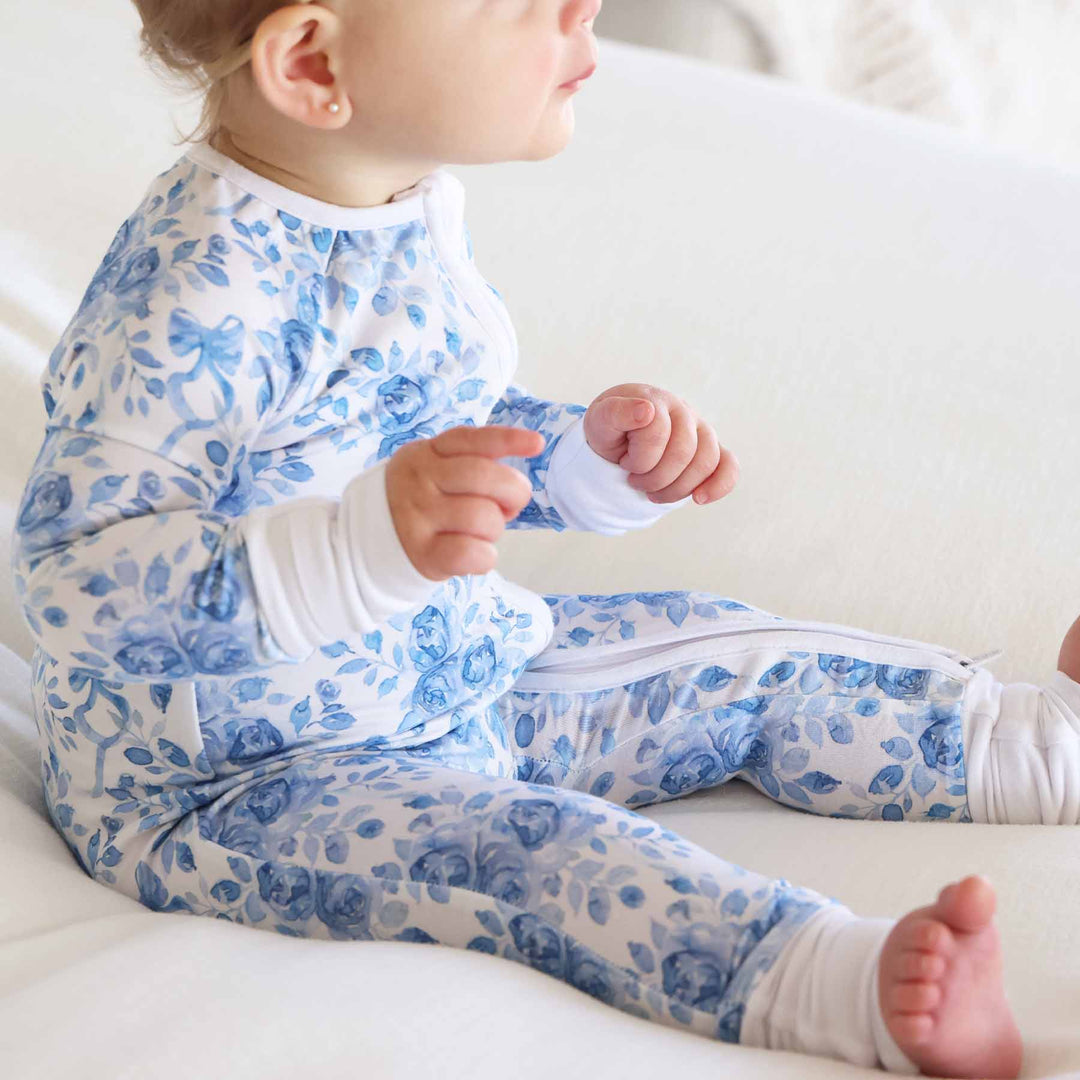 baby girl sitting wearing bamboo viscose betsy's blooms convertible pajama romper 