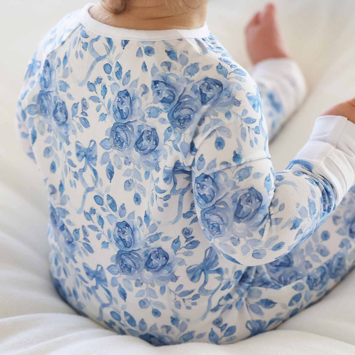 betsy's blooms blue and white rose and ribbon bow printed convertible zip romper pajama for baby and toddler girls 