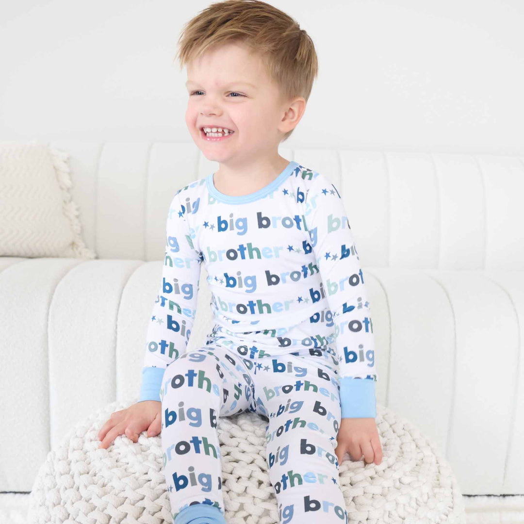 boy wearing big brother two piece pajama set