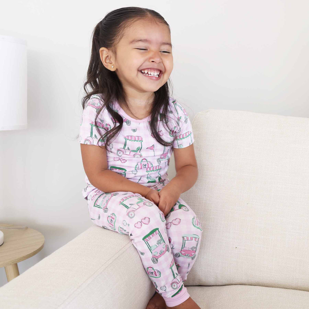 pink golf cart, duffel bag, flag and heart sunglasses two piece pajama set for kids 