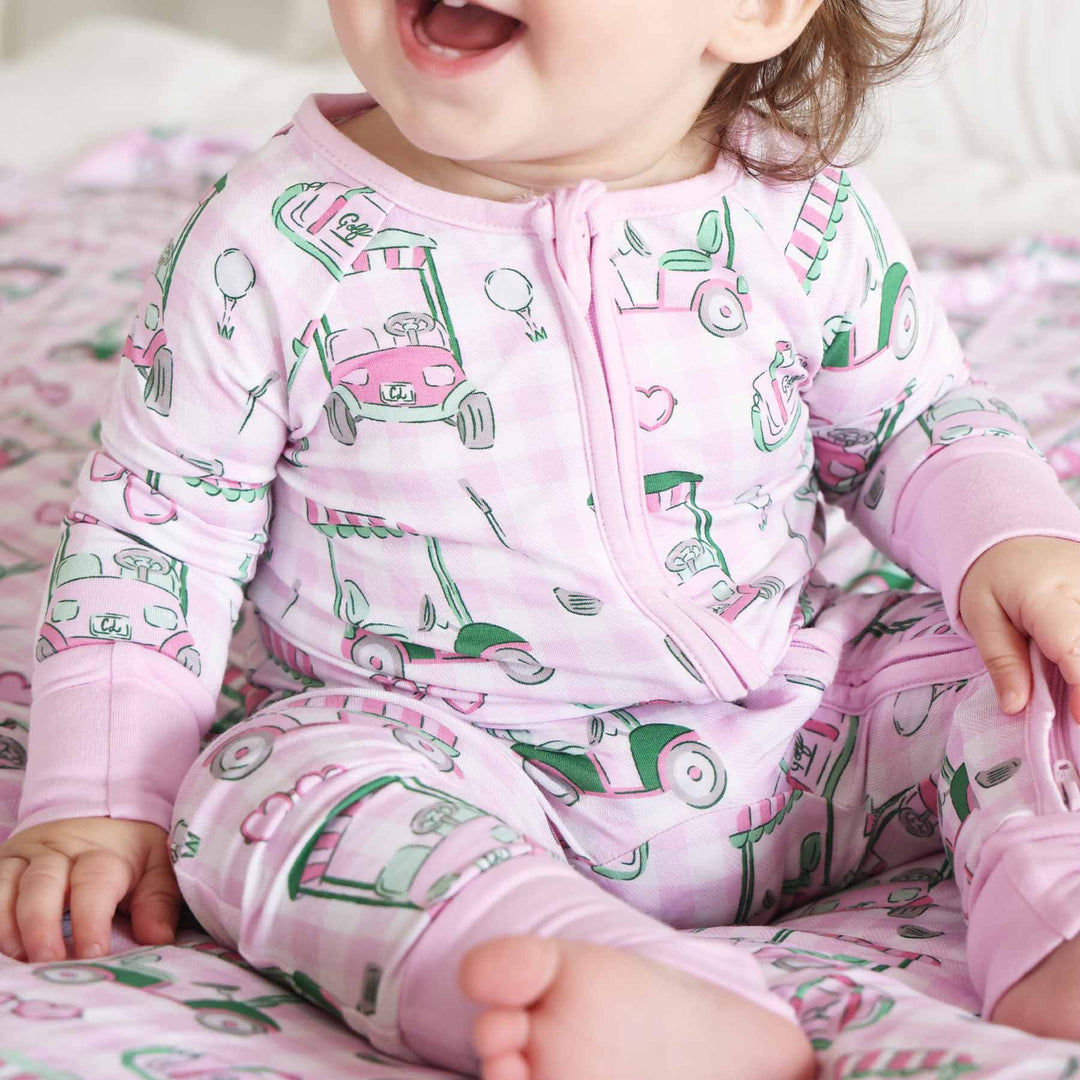 pink golf convertible zip romper pajama for baby and toddler girls 