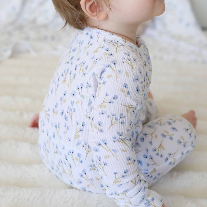 dainty blue floral waffle zip romper for babies 