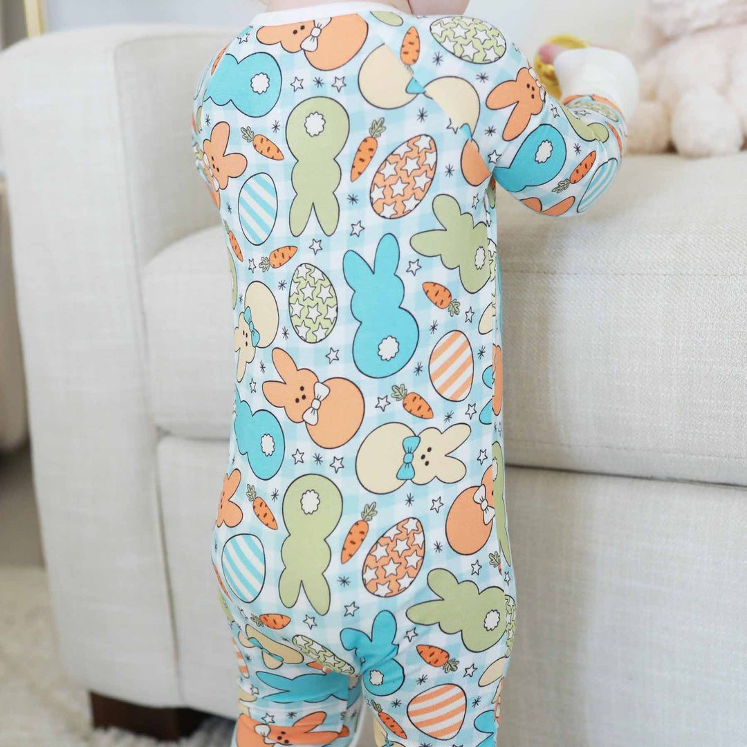 blue, green, orange and yellow easter zip pajama romper for babies and toddlers