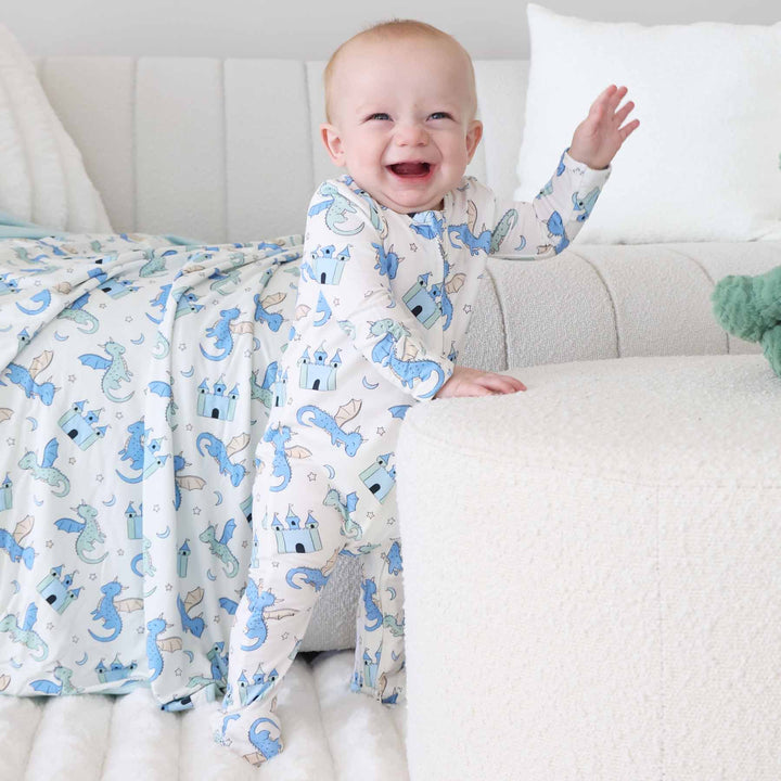 Infant sleeper with castles and dragons printed all over