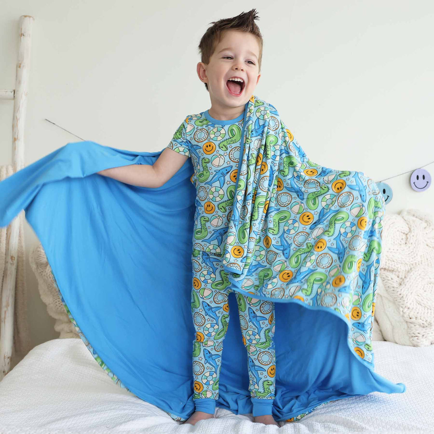 bamboo blanket for boys with pool floaties blue and green 