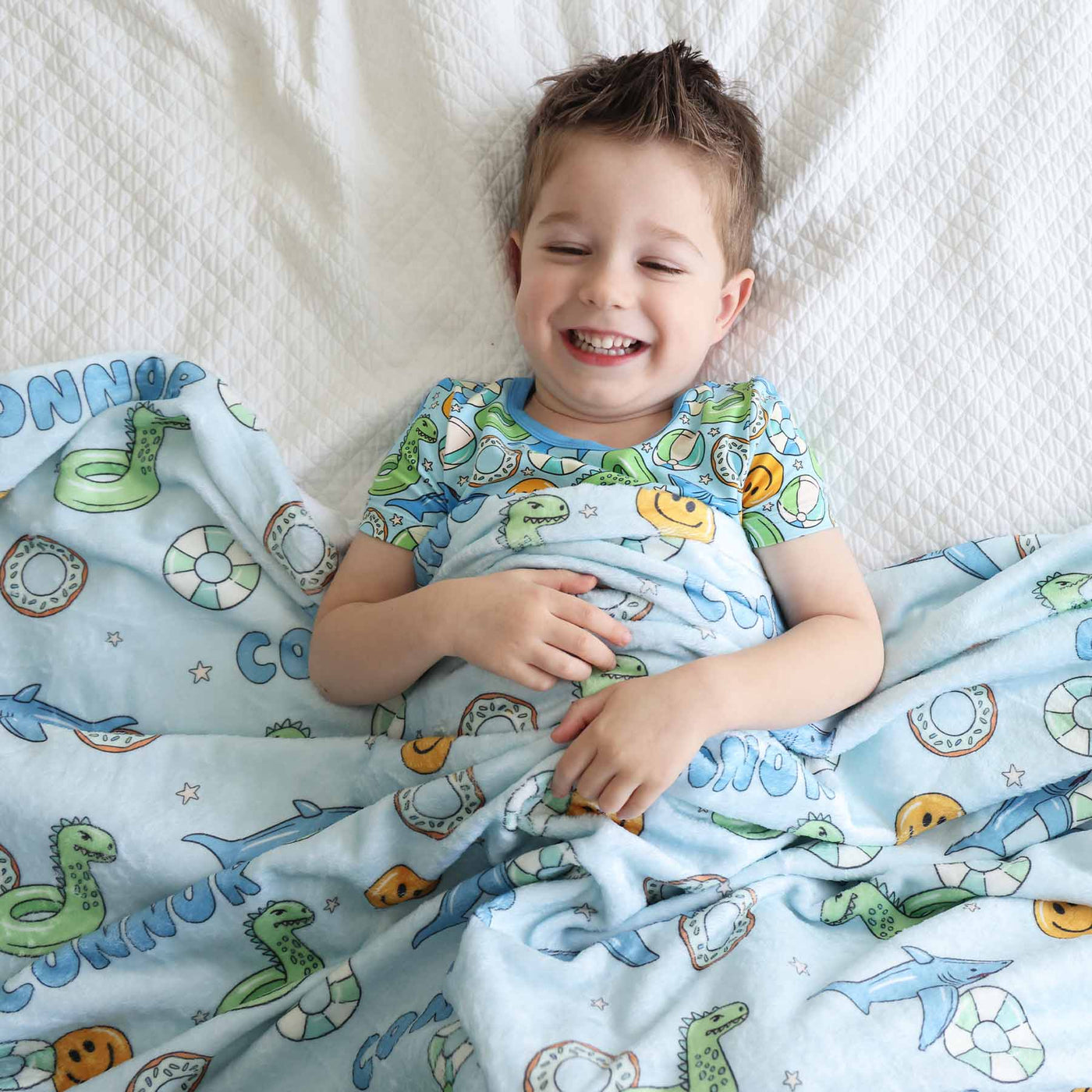 blanket for kids with floaties on it blue and green 