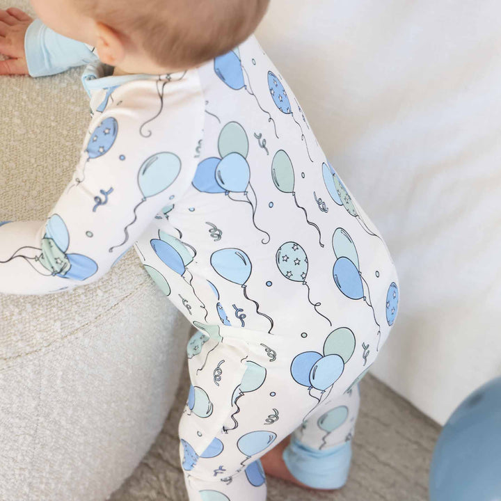 blue and green balloon and streamer bamboo viscose zip romper pajama for boys 