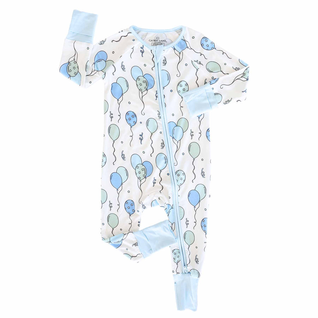 blue and green balloon and streamer convertible zip romper pajama with blue trim for boys 