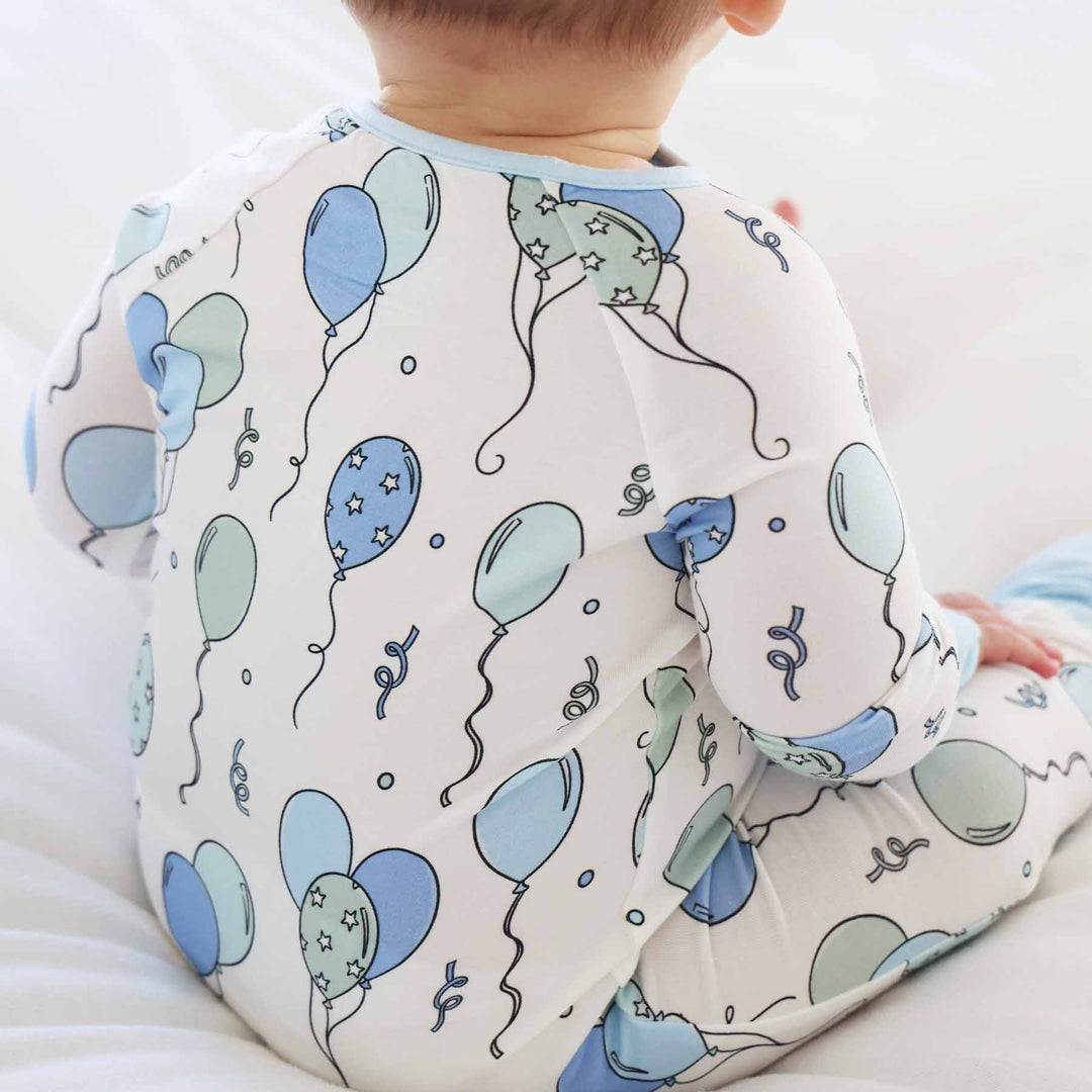 blue and green balloon and streamer bamboo convertible zip romper 