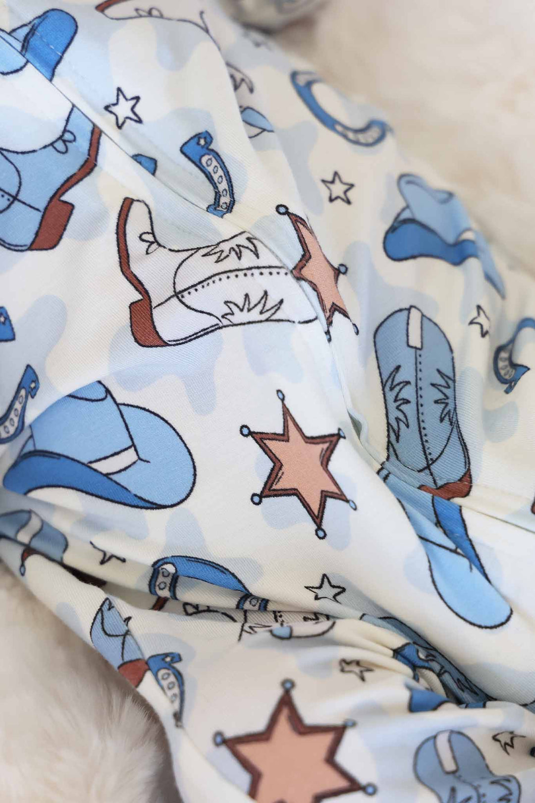 closeup of blue rodeo dreams footie pajama for boys 