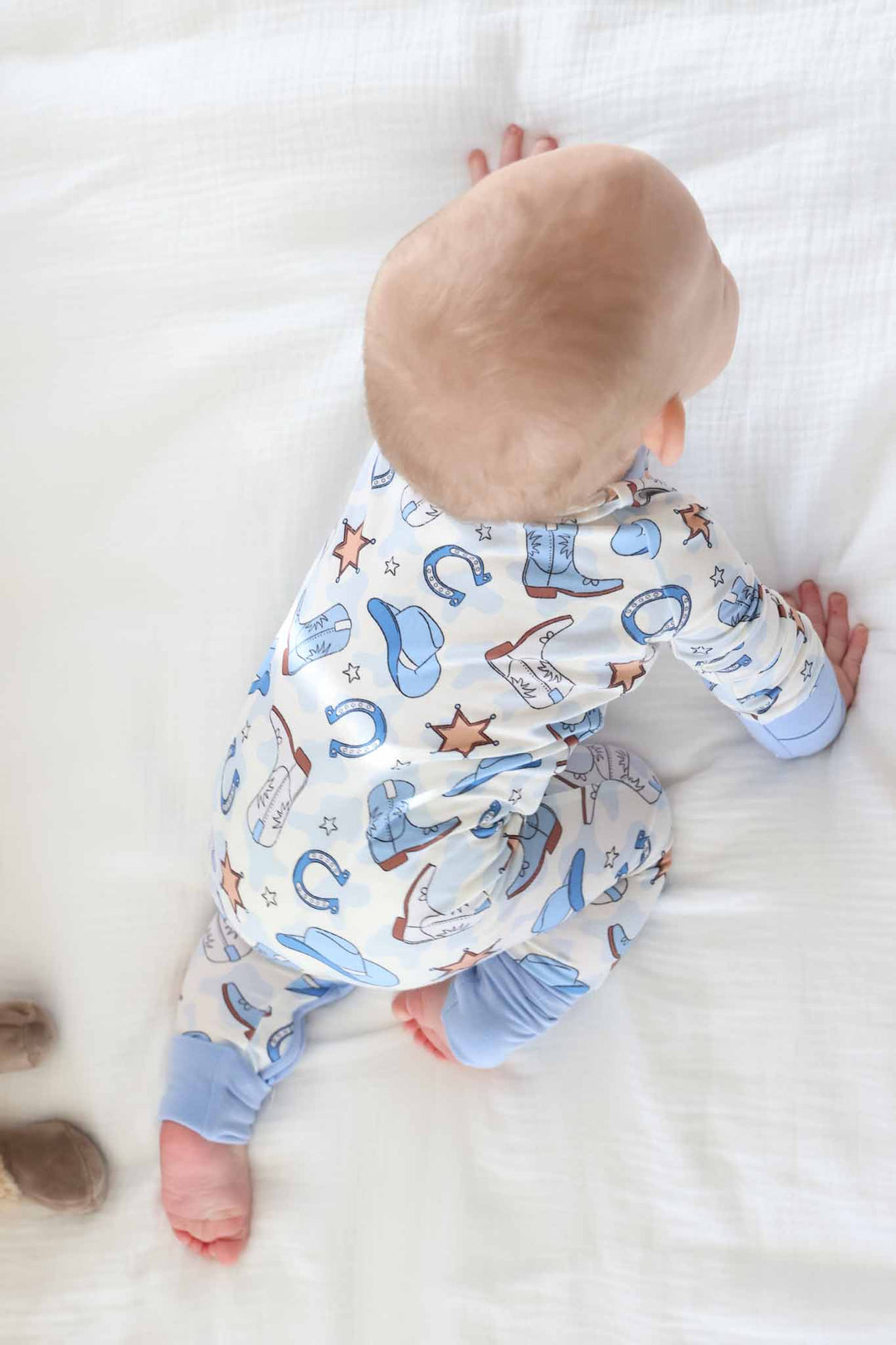 blue cowboy boot, horseshoe, cowboy hat, and sheriff star zip romper pajama 