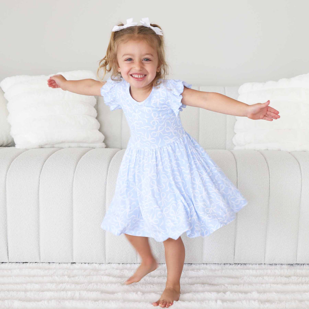 light blue and white ruffle twirl dress with bows