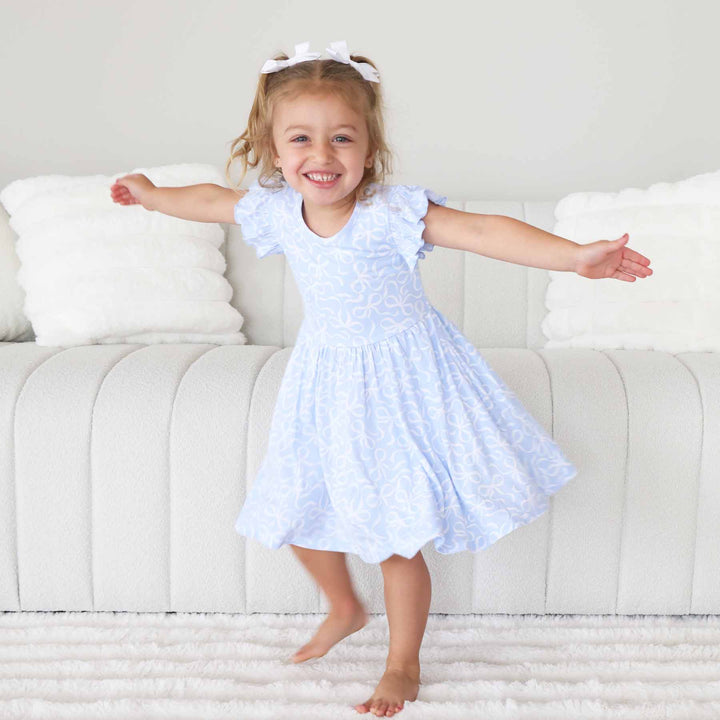 light blue and white ruffle twirl dress with bows