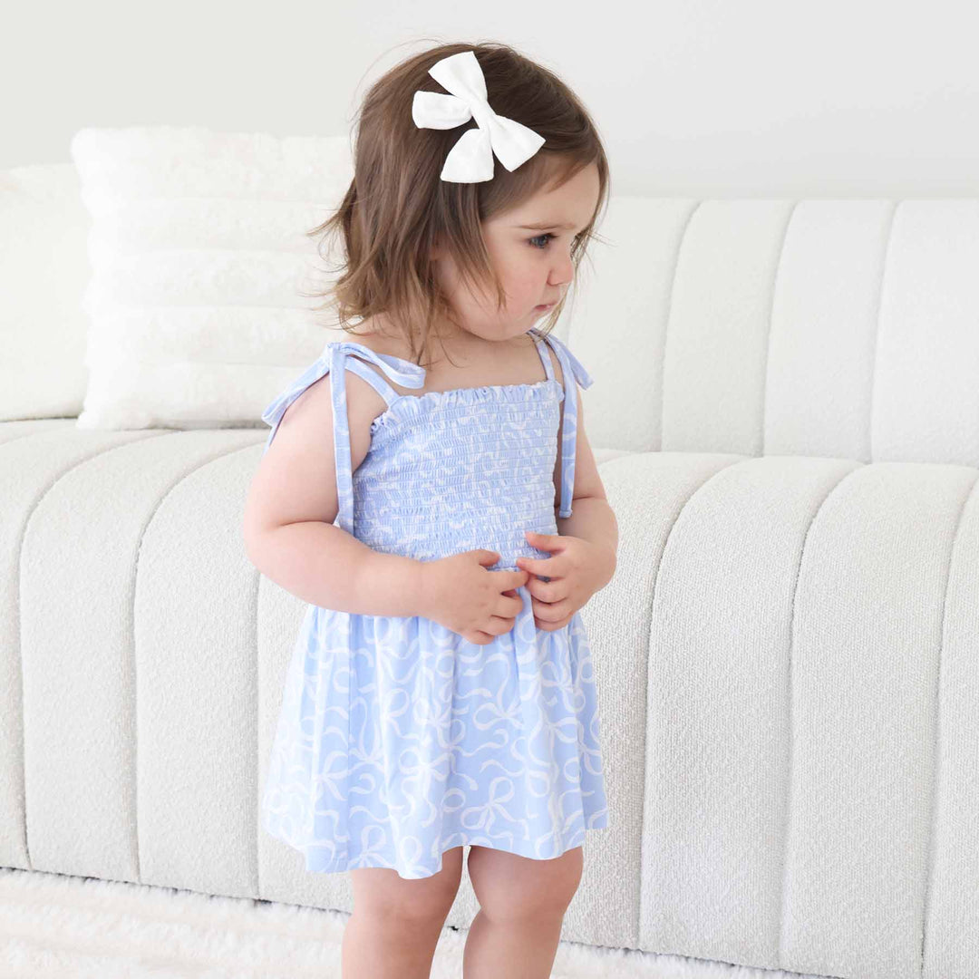 spaghetti strap bow tie shoulder smocked bodysuit with bows 