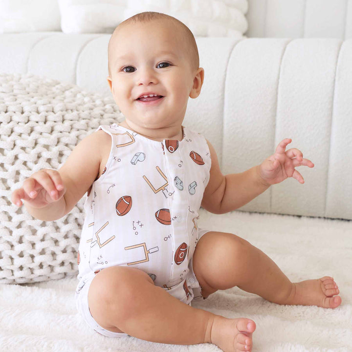 neutral football snap romper for babies