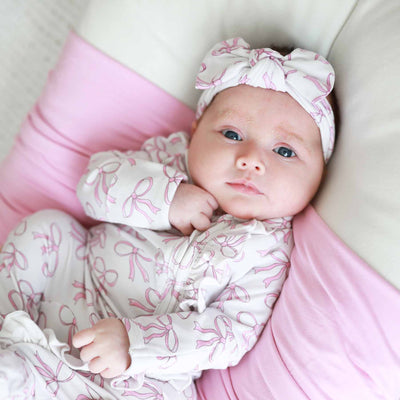 white baby headwrap with pink bows 