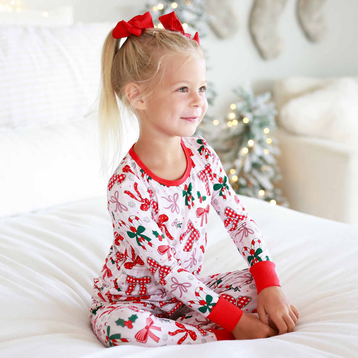 Little girl wearing the Bow What Fun Two Piece Pajama Set