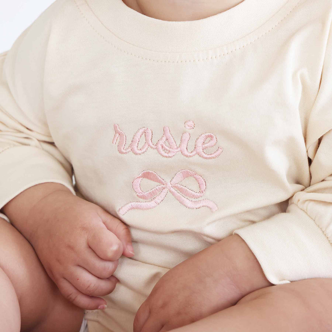 embroidered name and bow long sleeve romper 