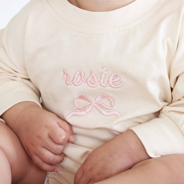 embroidered name and bow long sleeve romper 