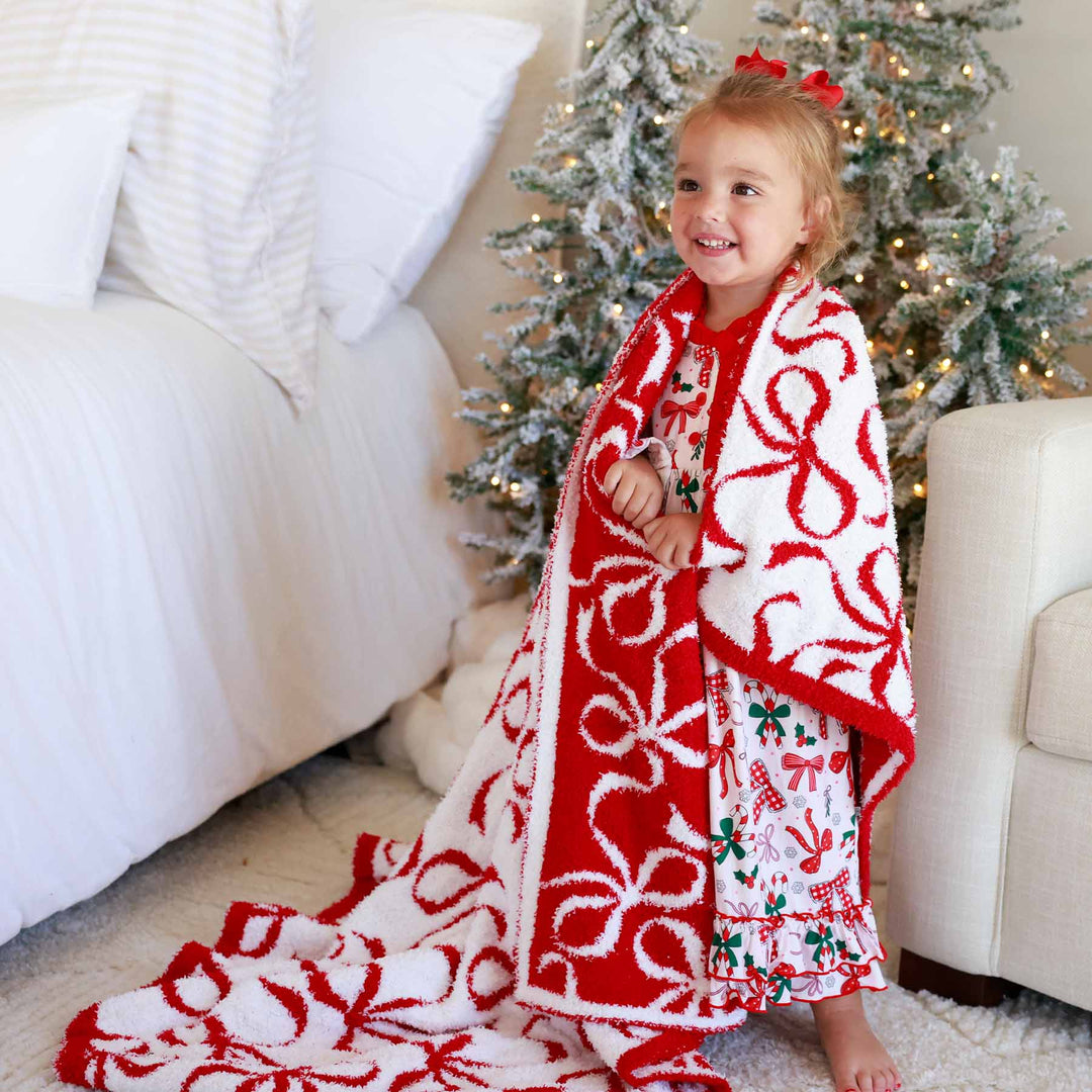 girly bow luxe blanket for christmas coming in three sizes — baby, toddler and throw