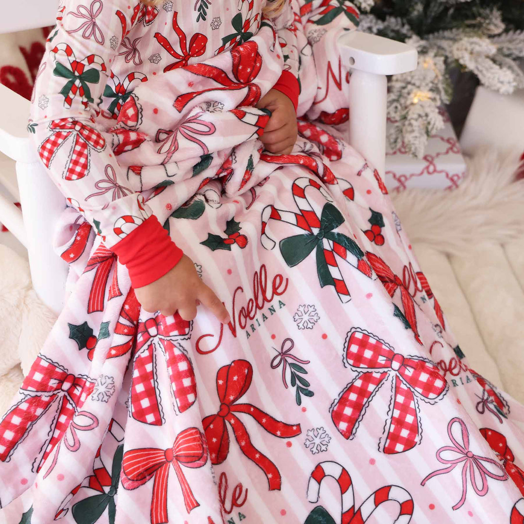 christmas bow personalized blanket for kids pink, red, green and white 