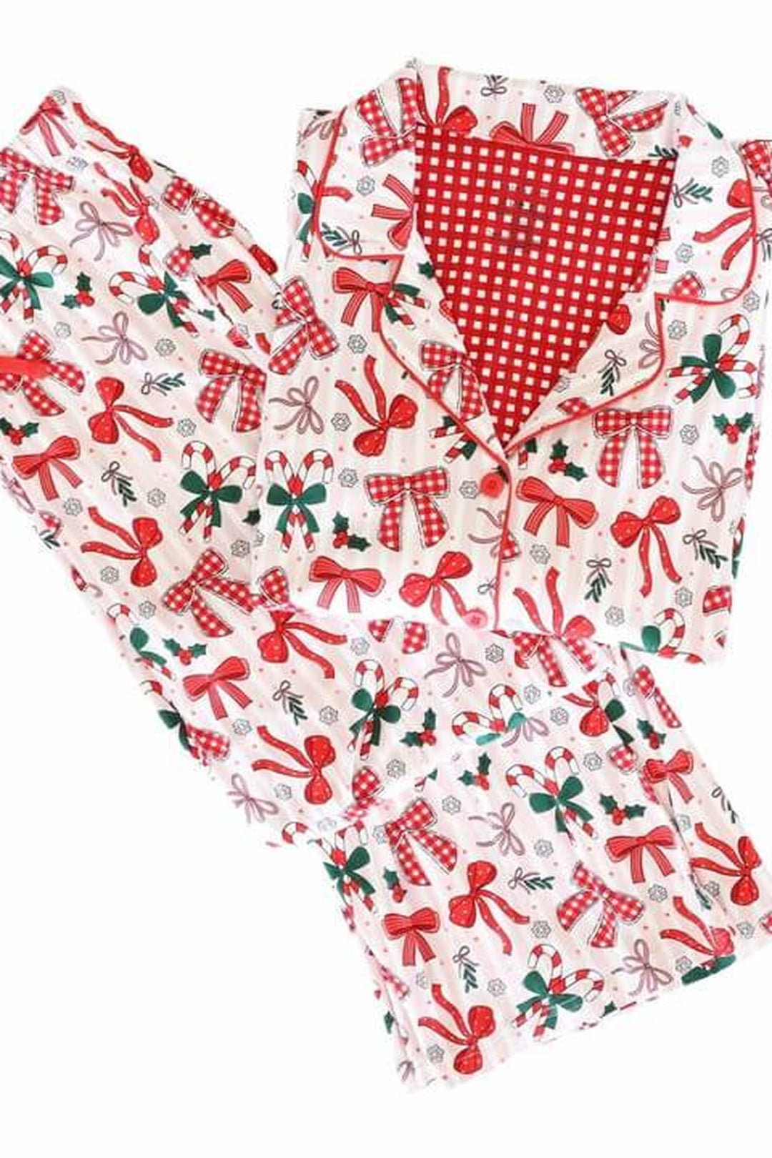 Adult Caden Lane two-piece holiday pajama set with a festive bow, candy cane, and holly print, featuring a collared button-up top and matching pants