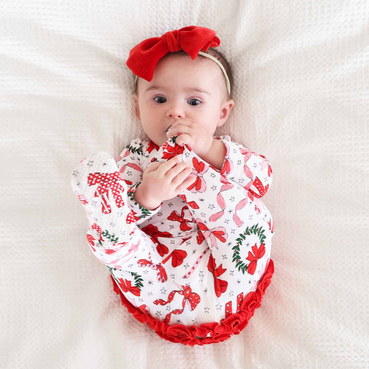 baby ruffle footie for girls with bows and wreaths 