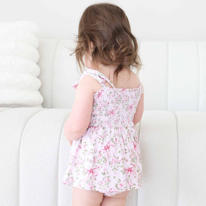 bow and floral smocked bodysuit for baby and toddler girls 