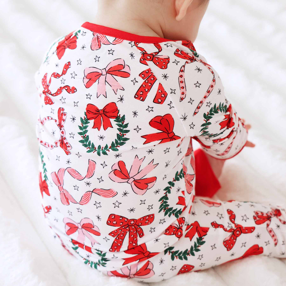 bow christmas pajama romper with wreaths for toddlers