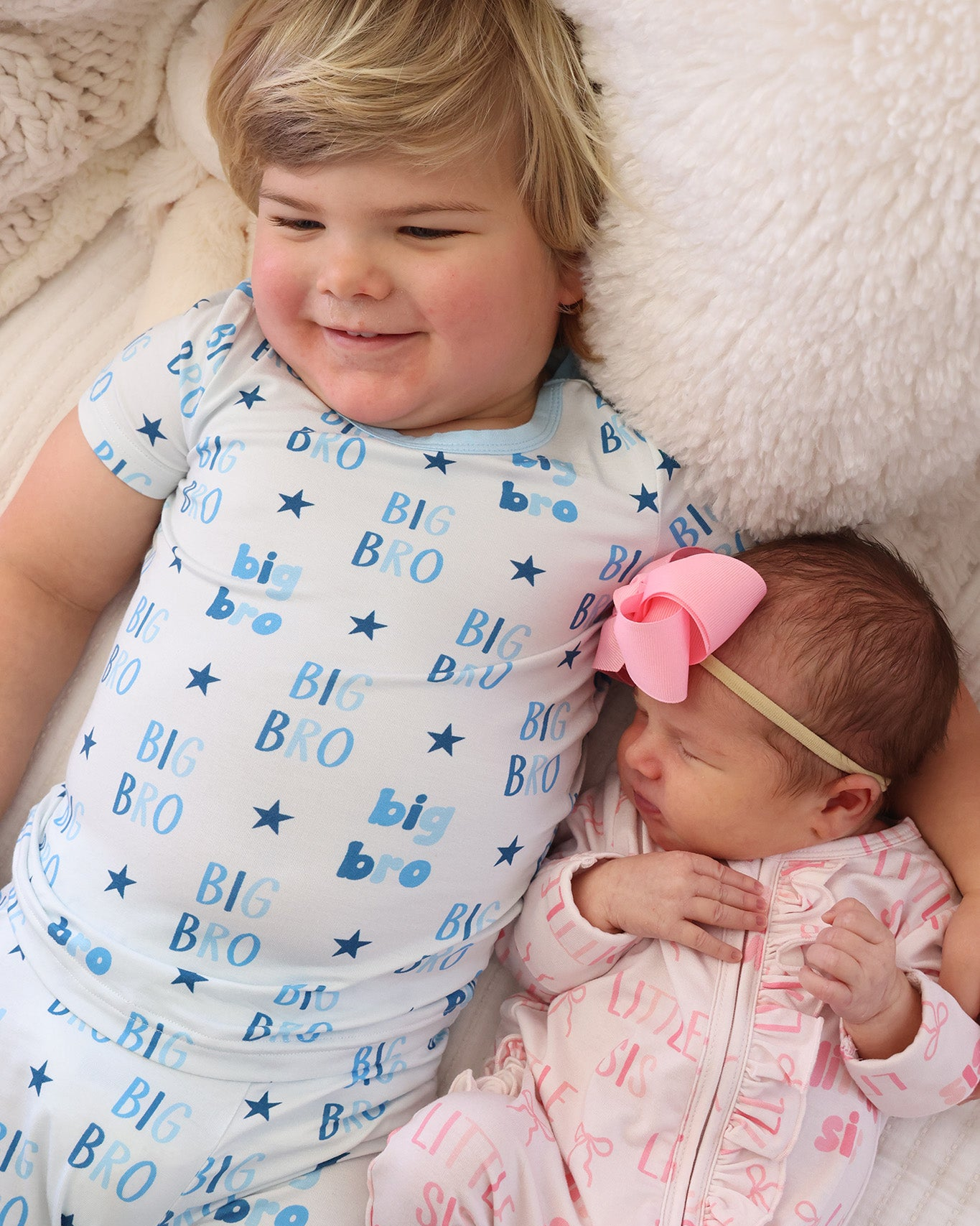 brother and sister wearing matching sibling pjs