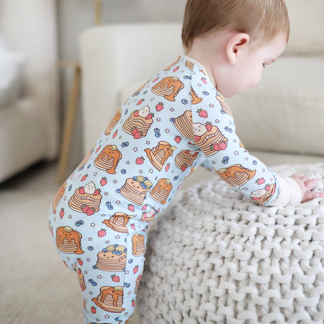 baby pajama romper with pancakes and fruit blue