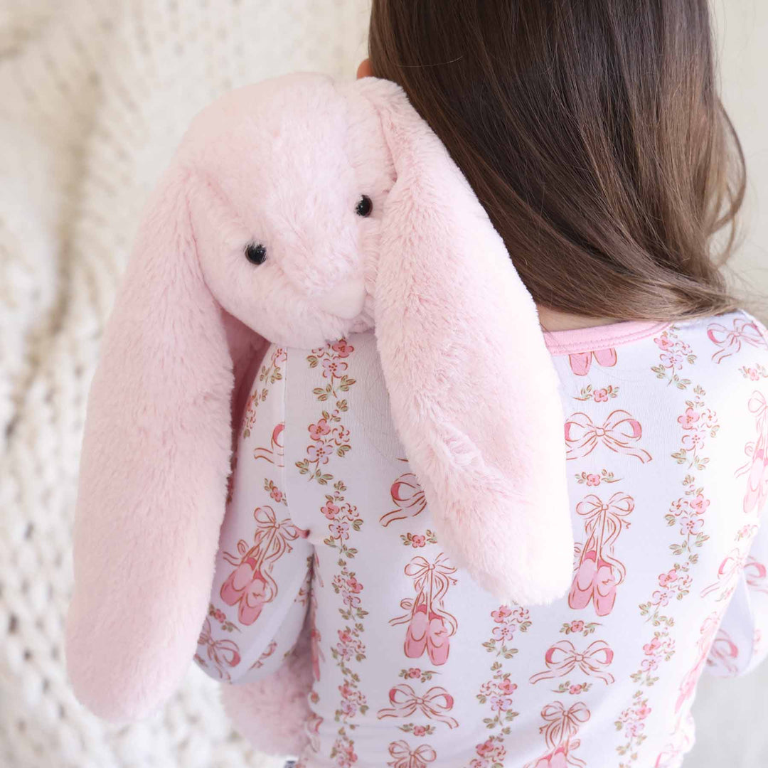 oversized pink bunny stuffed animal with long ears 