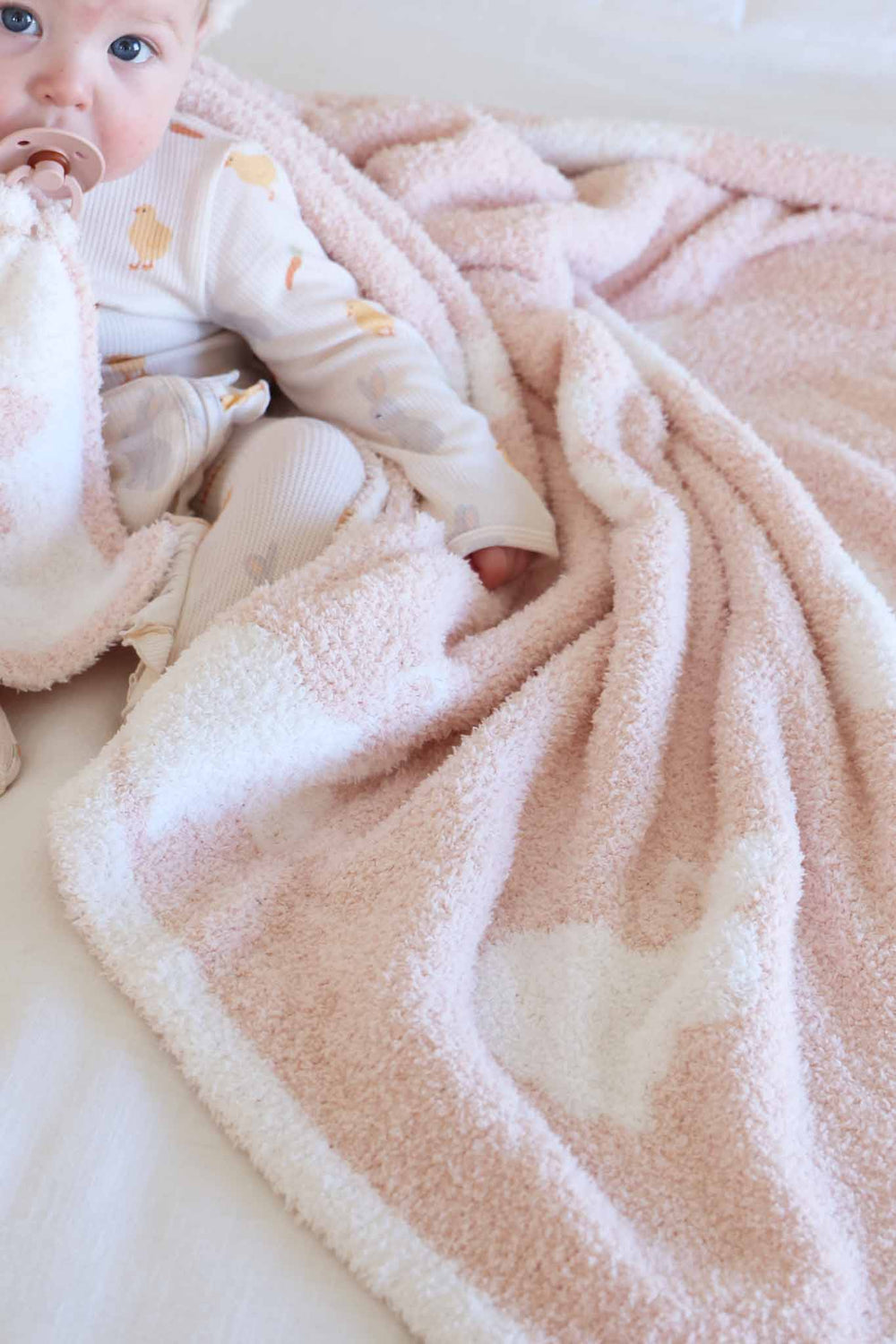 baby girl in easter zipper footie with pink bunny foo foo cuddlelane blanket 