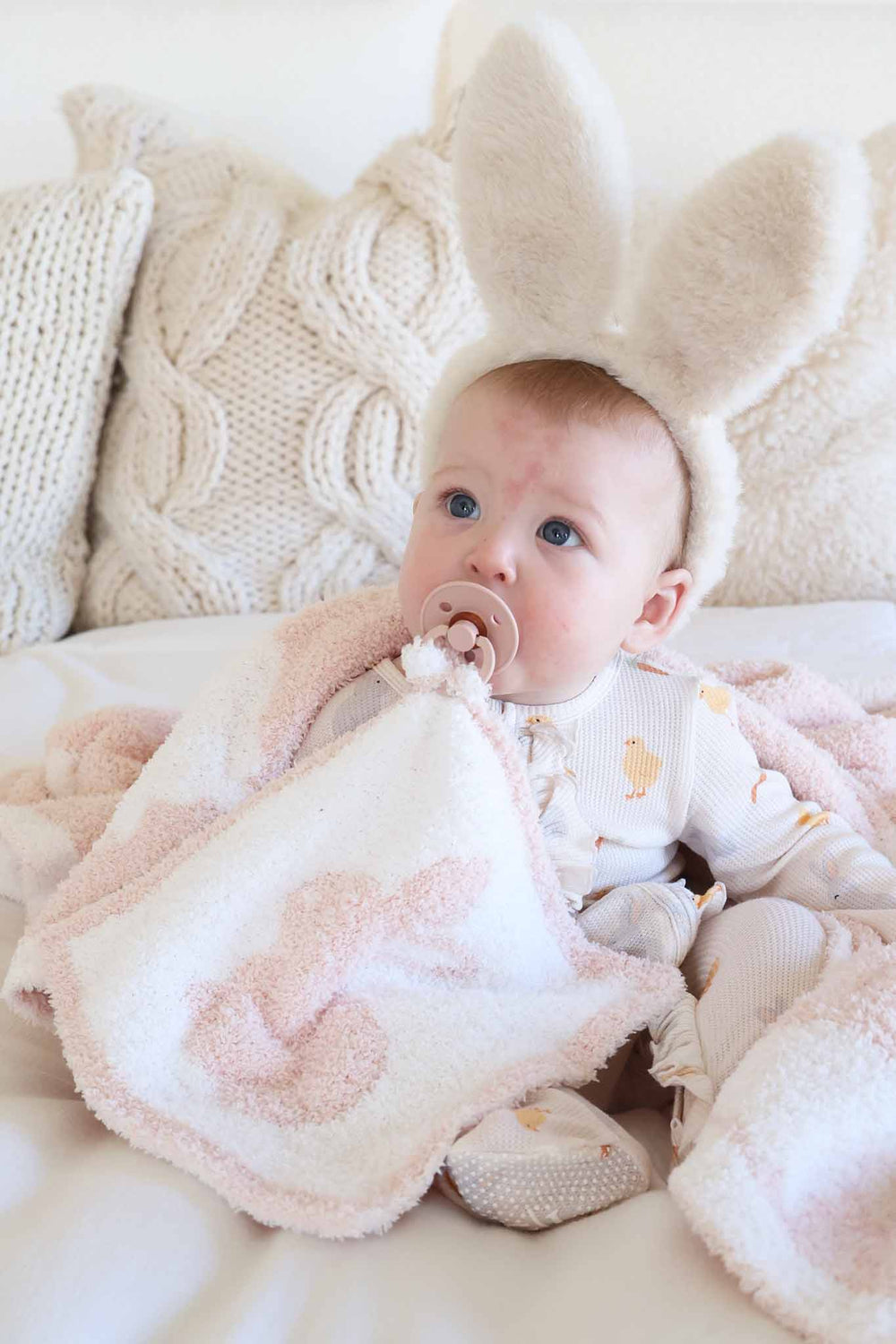 baby girl wearing bunny ears with pacifier and pink bunny easter lovey 