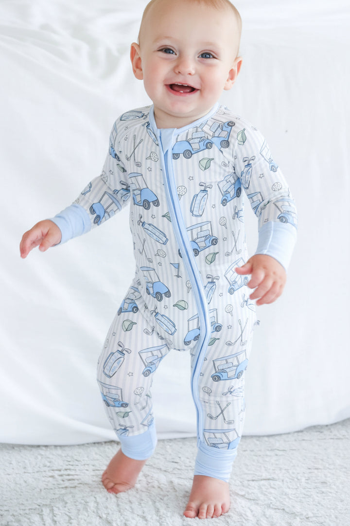 baby in golf pajama romper