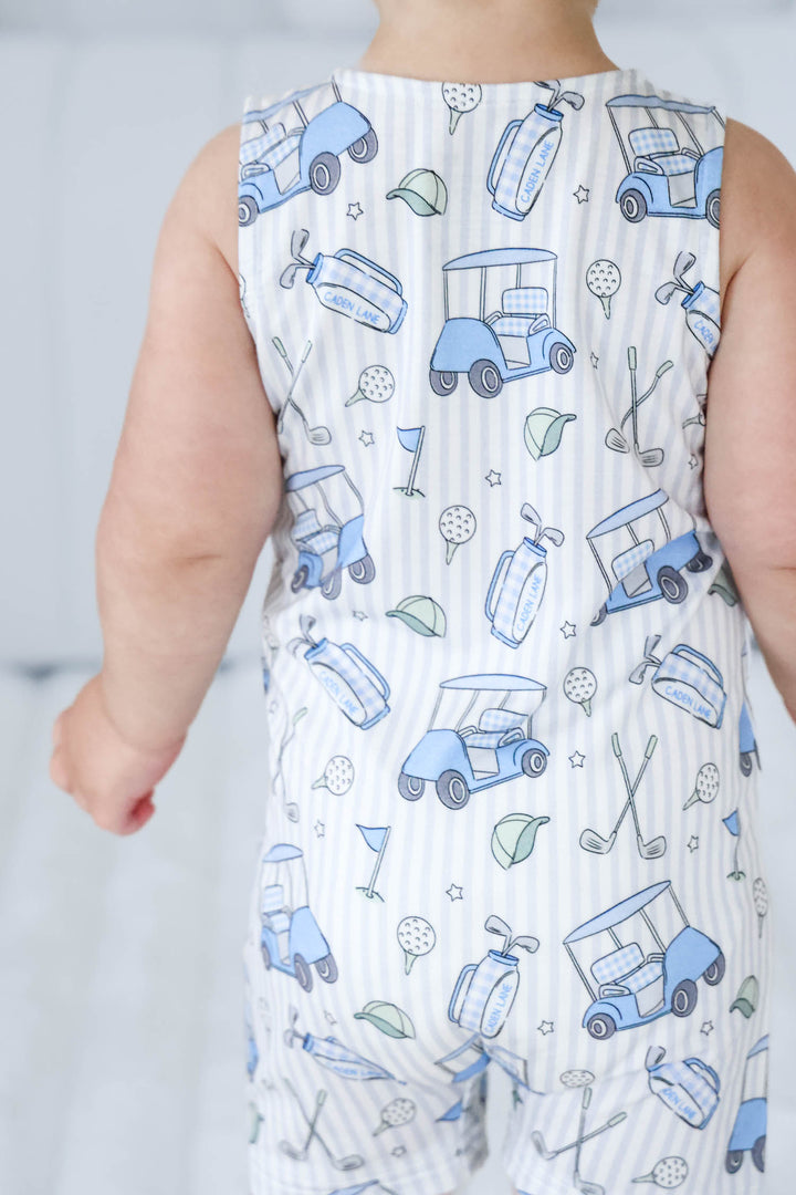 back view of caddie crew blue sleeveless snap romper for boys